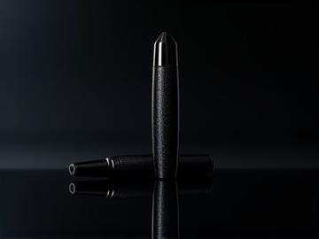 'Midnight Whisper' fountain pen, a sleek black pen with subtle, shimmering details, marked with a prominent 'SOLD' banner.