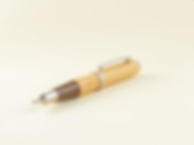 Light-toned fountain pen made from laminated bamboo, showing distinct parallel grain lines.
